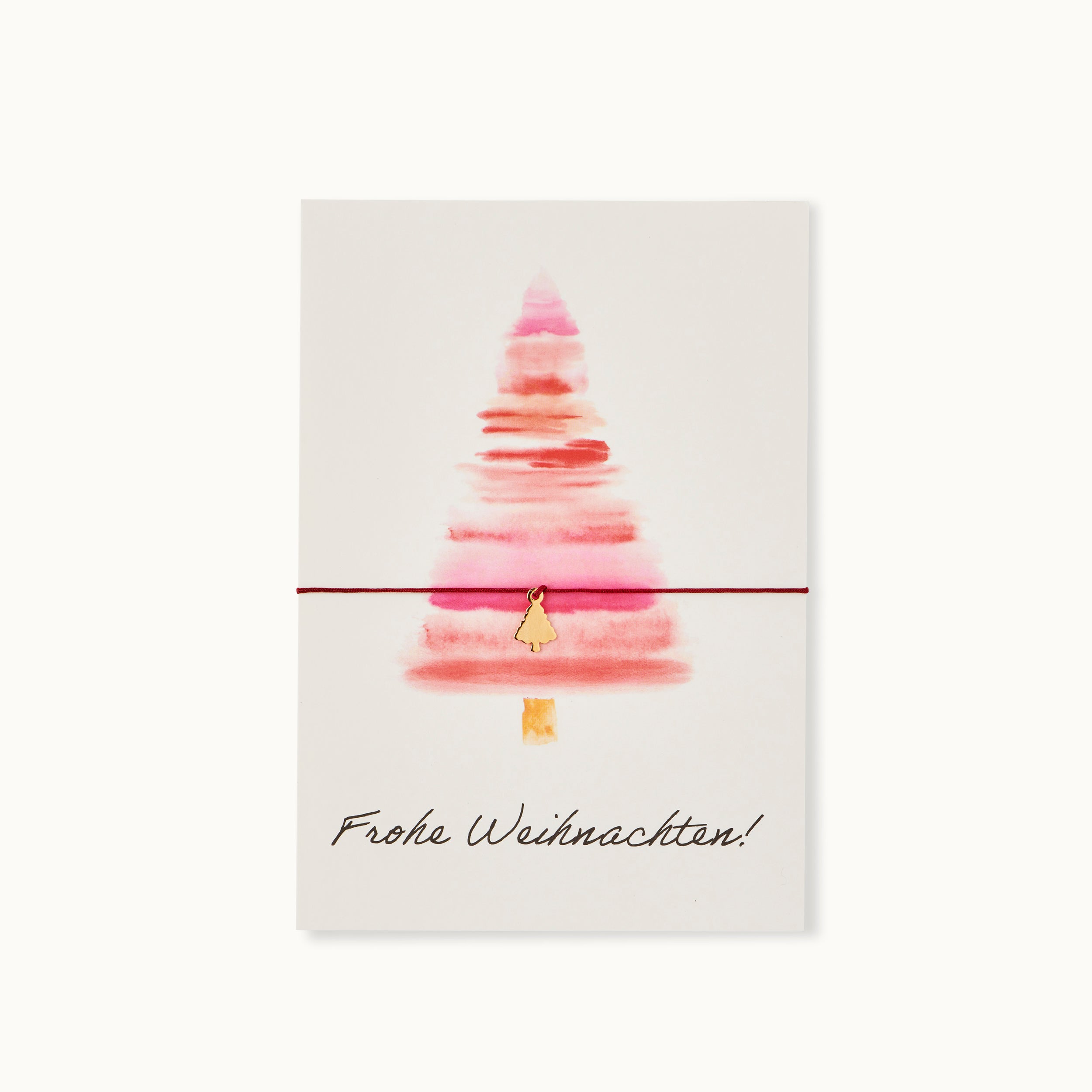Frohe Weihnachten! Karte mit einem Weihnachtsbaum als 18K vergoldeter Anhänger an einem dunkelgrünen Armband.